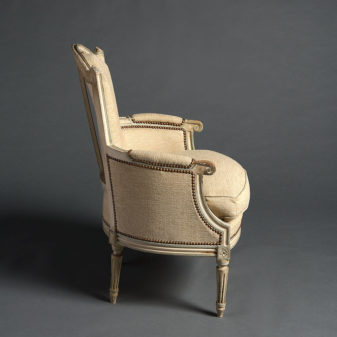 A pair of late 19th century louis xvi style painted bergeres