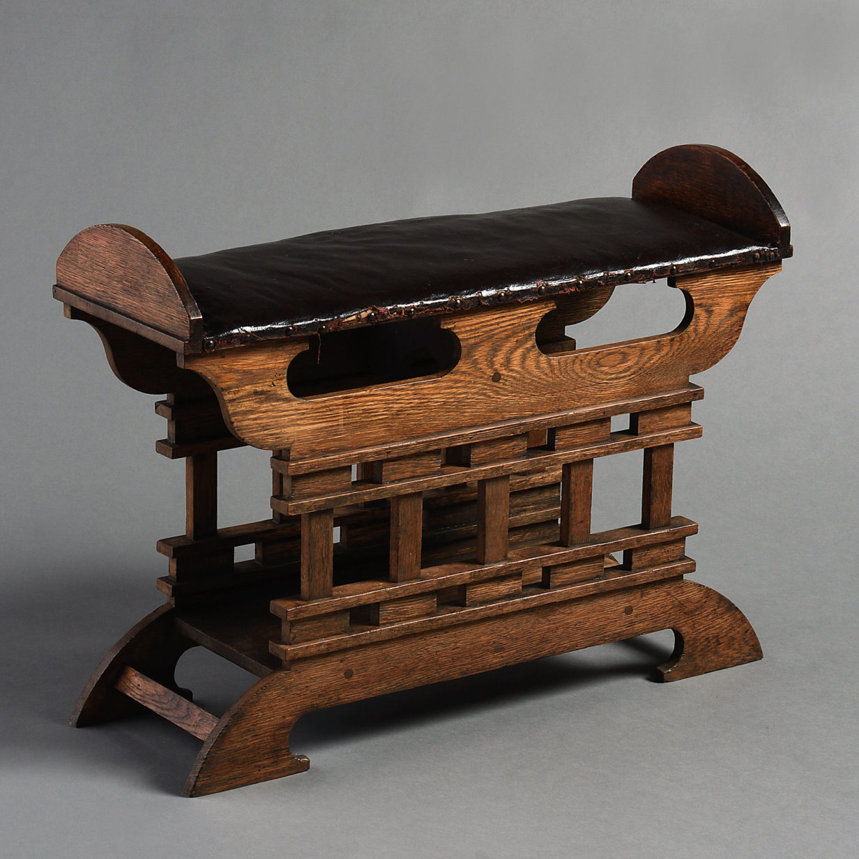 A late 19th century aesthetic movement oak hall stool