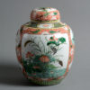 A 19th century qing dynasty famille verte jar & cover
