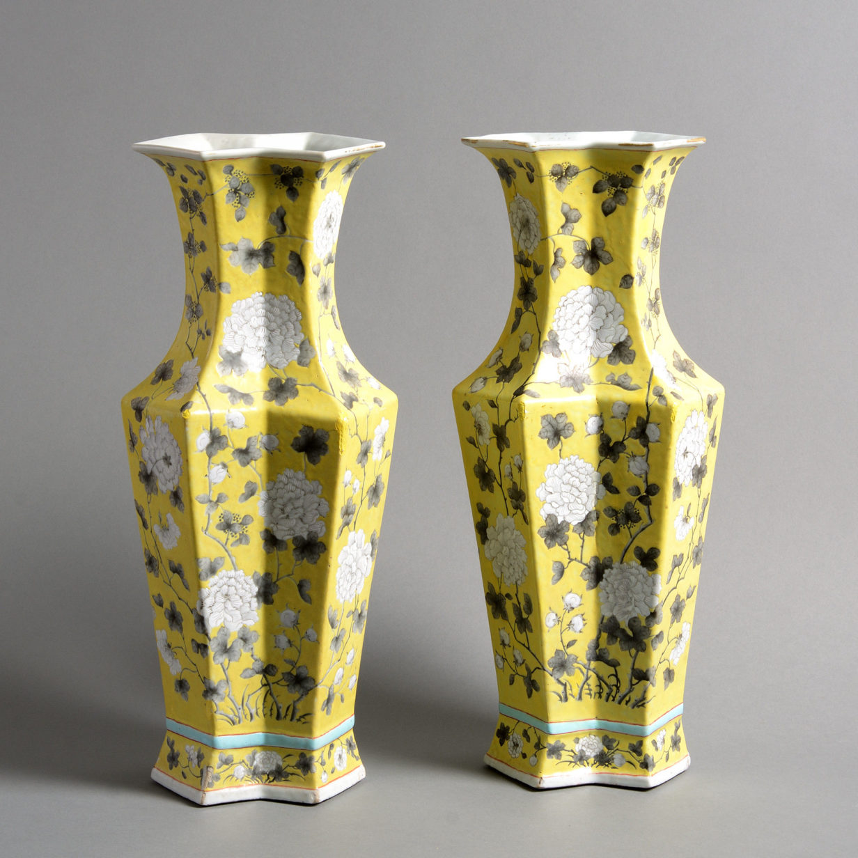A rare pair of 19th century qing dynasty yellow glazed tall vases