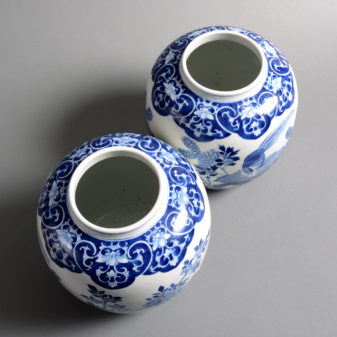 A pair of 19th century qing dynasty blue & white porcelain vases