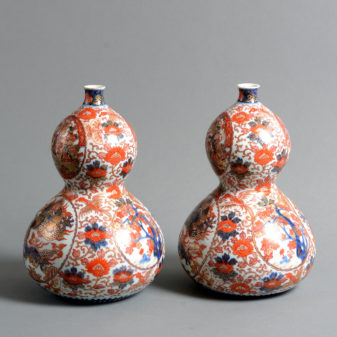 A pair of 19th century imari porcelain double gourd form vases