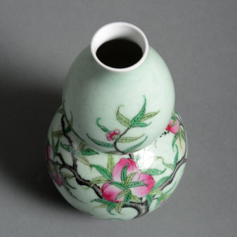 An early 20th century celadon gourd vase