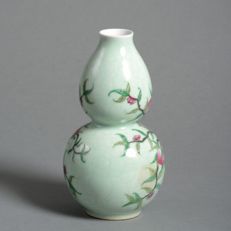 An early 20th century celadon gourd vase