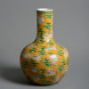 A 19th century qing dynasty yellow ground bottle vase