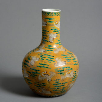 A 19th century qing dynasty yellow ground bottle vase