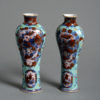 A pair of 18th qing dynasty century clobbered vases