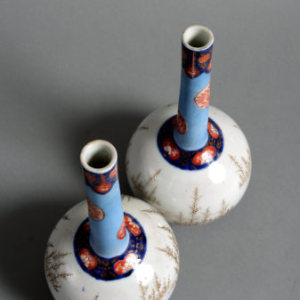 A pair of 19th century porcelain bottle vases