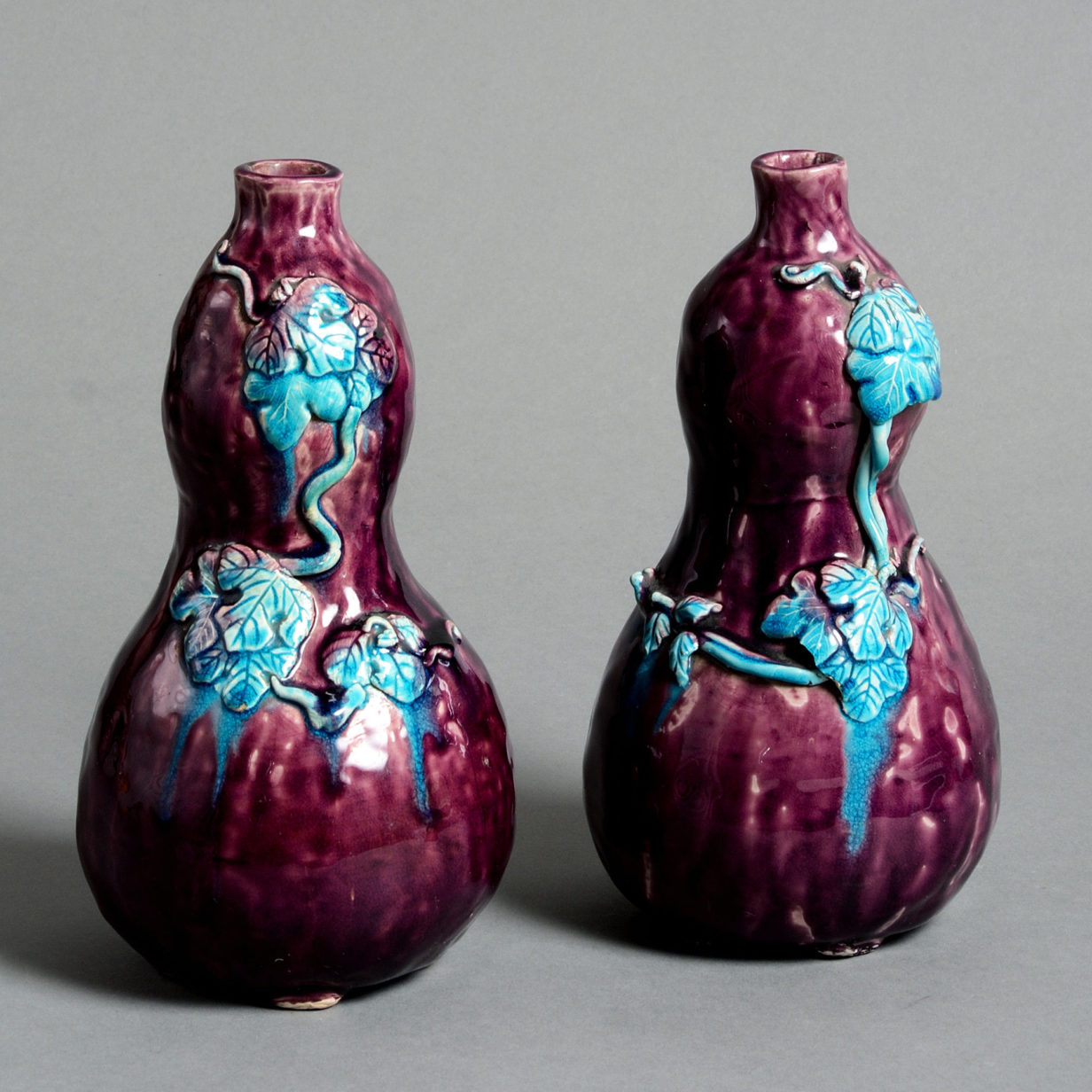 A pair of 19th century aubergine glazed gourd vases