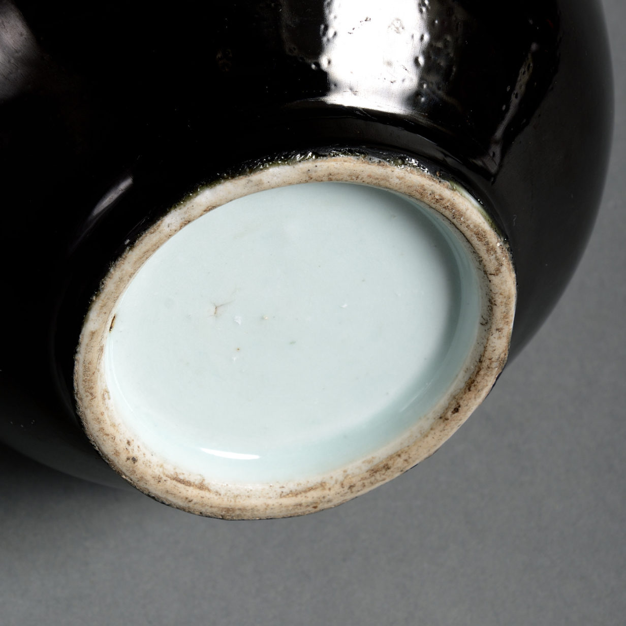 A 19th century black glazed porcelain bottle vase