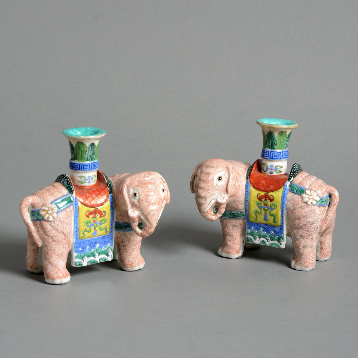 A pair of 19th century porcelain elephant incense stick holders