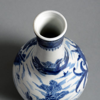 An 18th century blue and white glazed bottle vase