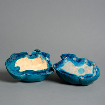 A 19th century pair of turquoise glazed buffalo