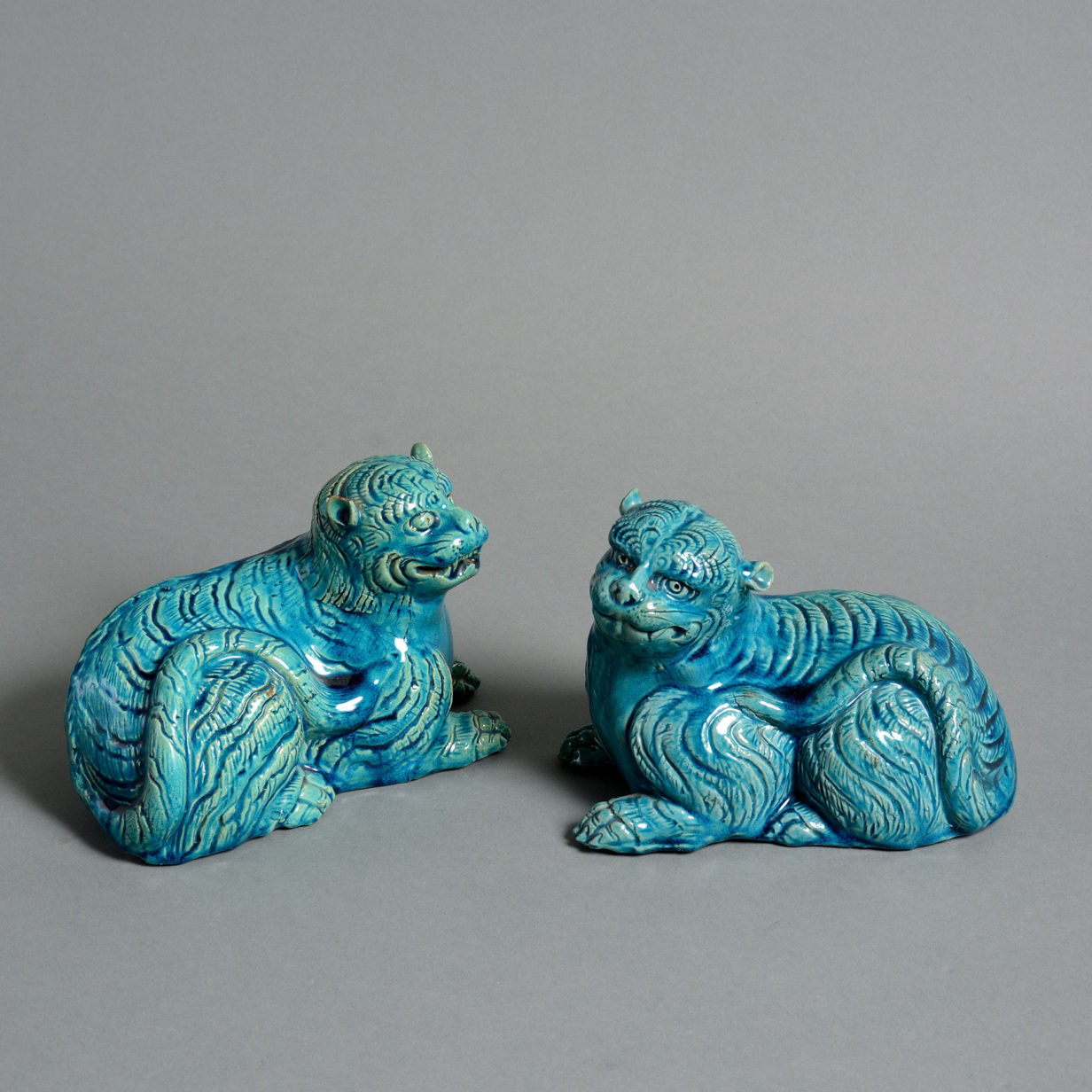 A pair of 19th century turquoise glazed porcelain tigers