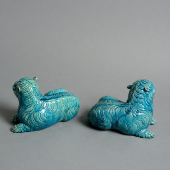 A pair of 19th century turquoise glazed porcelain tigers