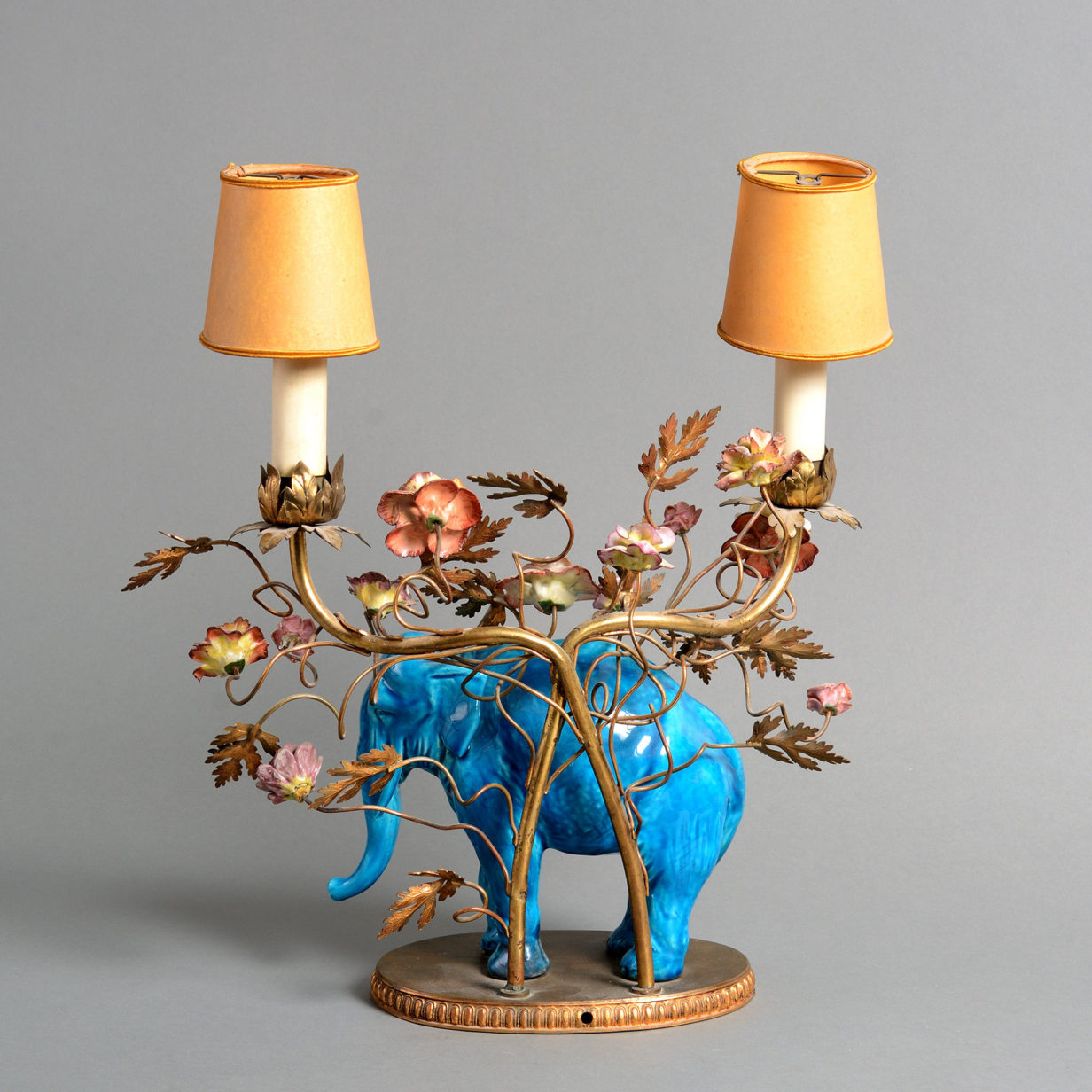 A pair of late 19th century porcelain & ormolu elephant candelabra