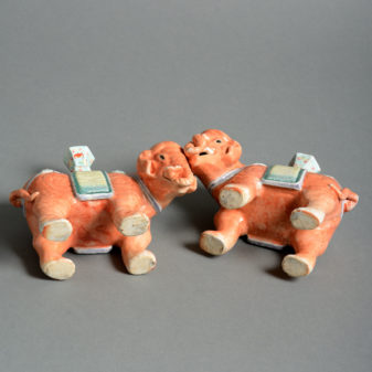 A pair of porcelain elephant candle holders
