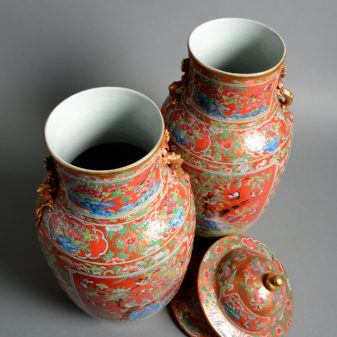 A pair of 19th century orange glazed vases