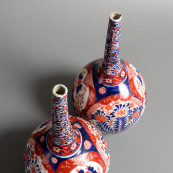 A pair of 19th century imari porcelain bottle vases