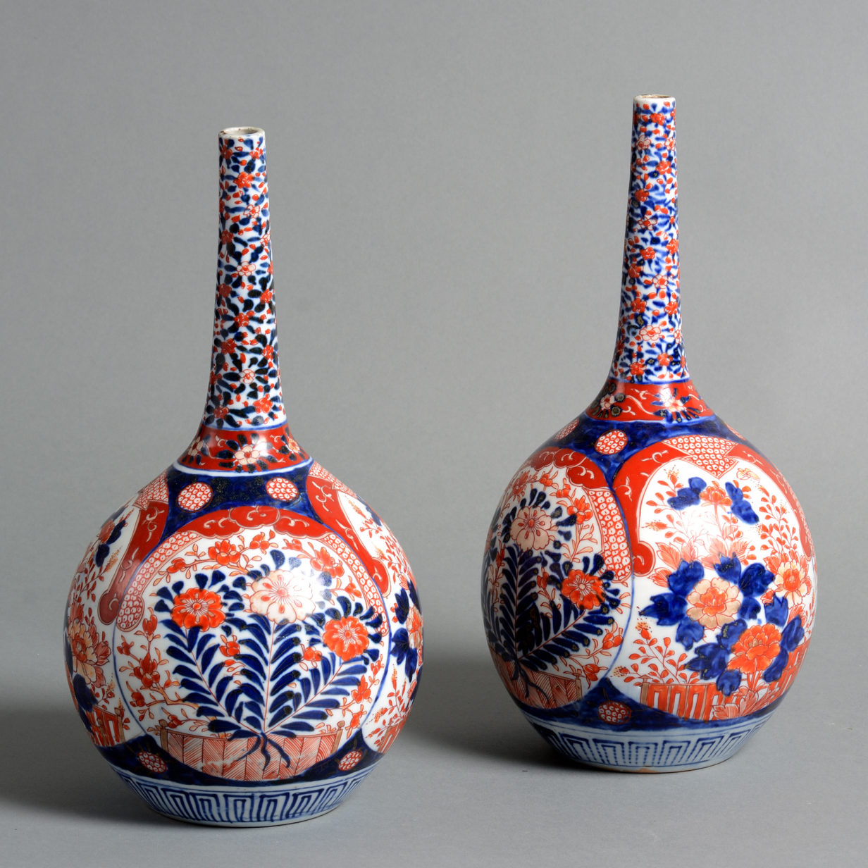 A pair of 19th century imari porcelain bottle vases
