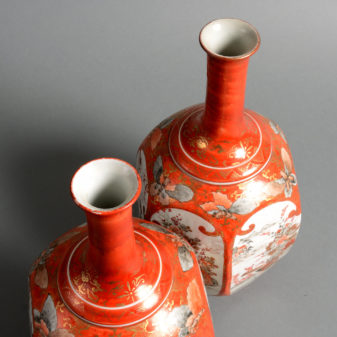 A 19th century pair of kutani porcelain bottle vases
