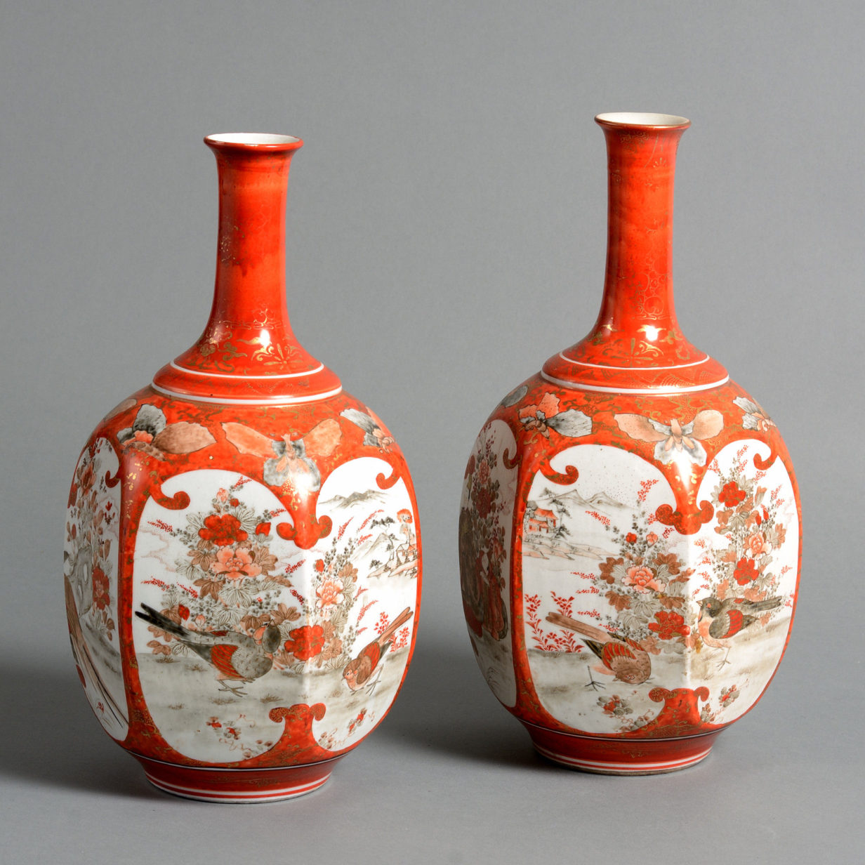 A 19th century pair of kutani porcelain bottle vases