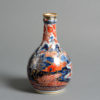 An 18th century clobbered porcelain bottle vase