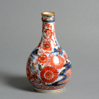 An 18th century clobbered porcelain bottle vase