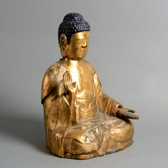A 19th century giltwood buddha
