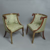 A rare 19th century pair of baltic brass mounted mahogany bergeres in the russian taste