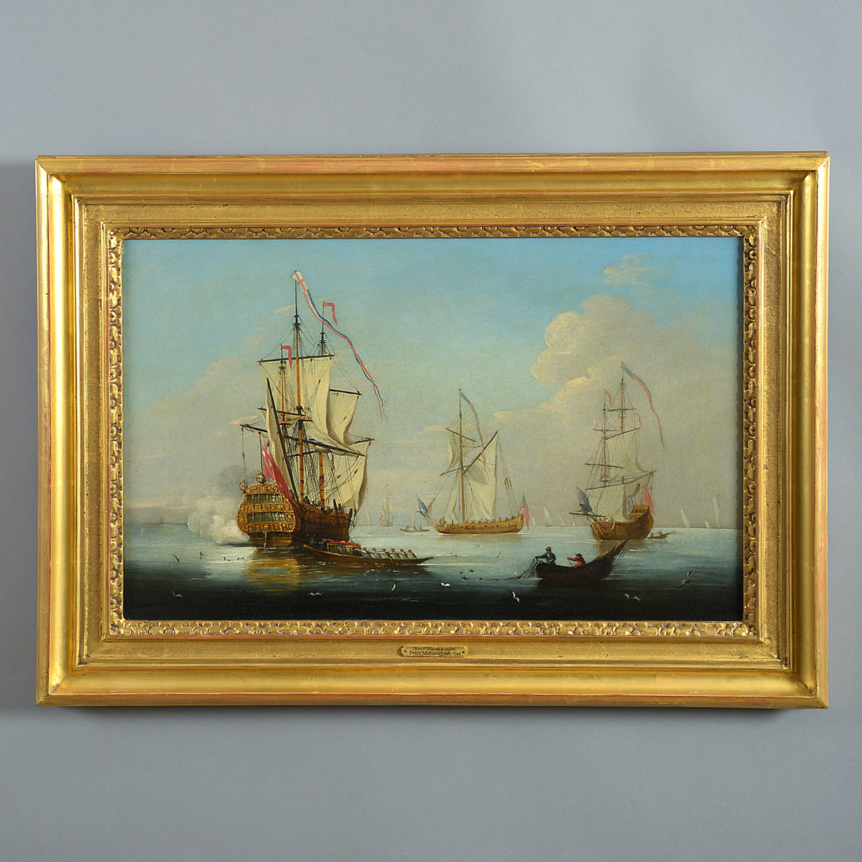 An 18th century english maritime scene - a warship firing a salute, attributed to peter monamy