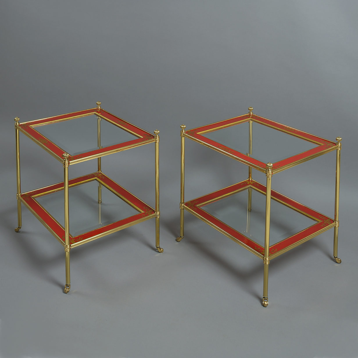 A mid-20th century pair of mallett red lacquer two tier tables