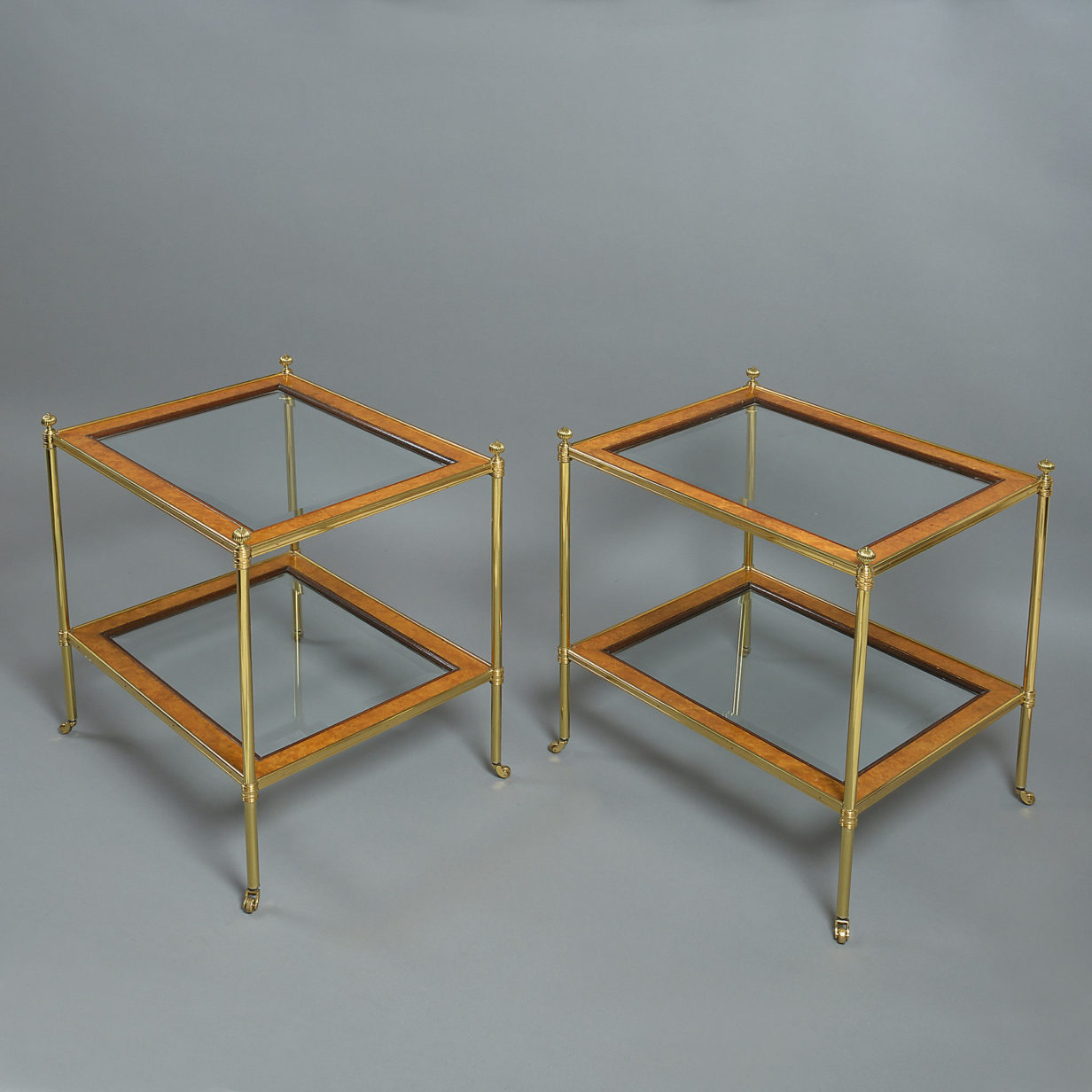 A 20th century pair of 'mallett' two tier tables