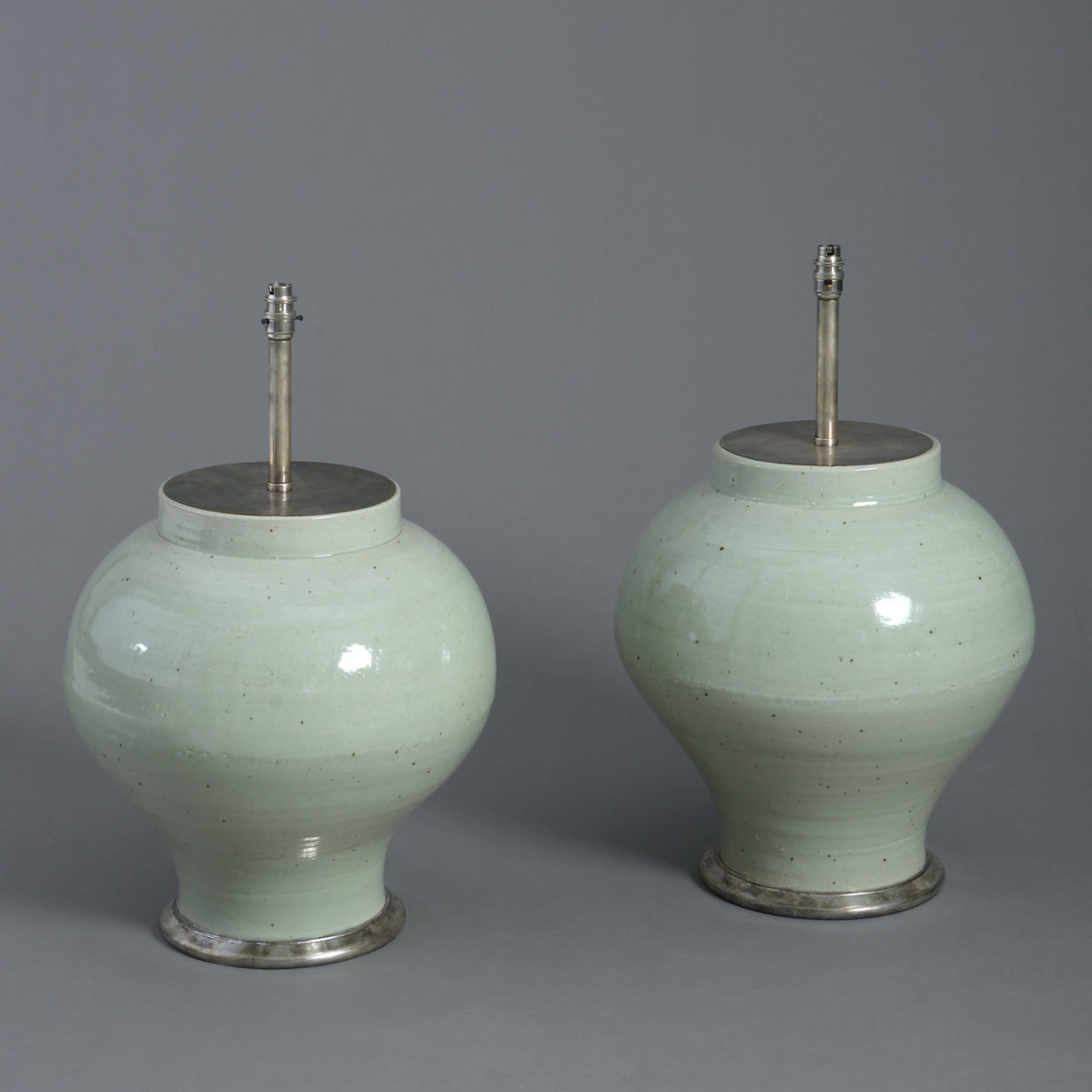 A large pair of 19th century celadon vases as lamps