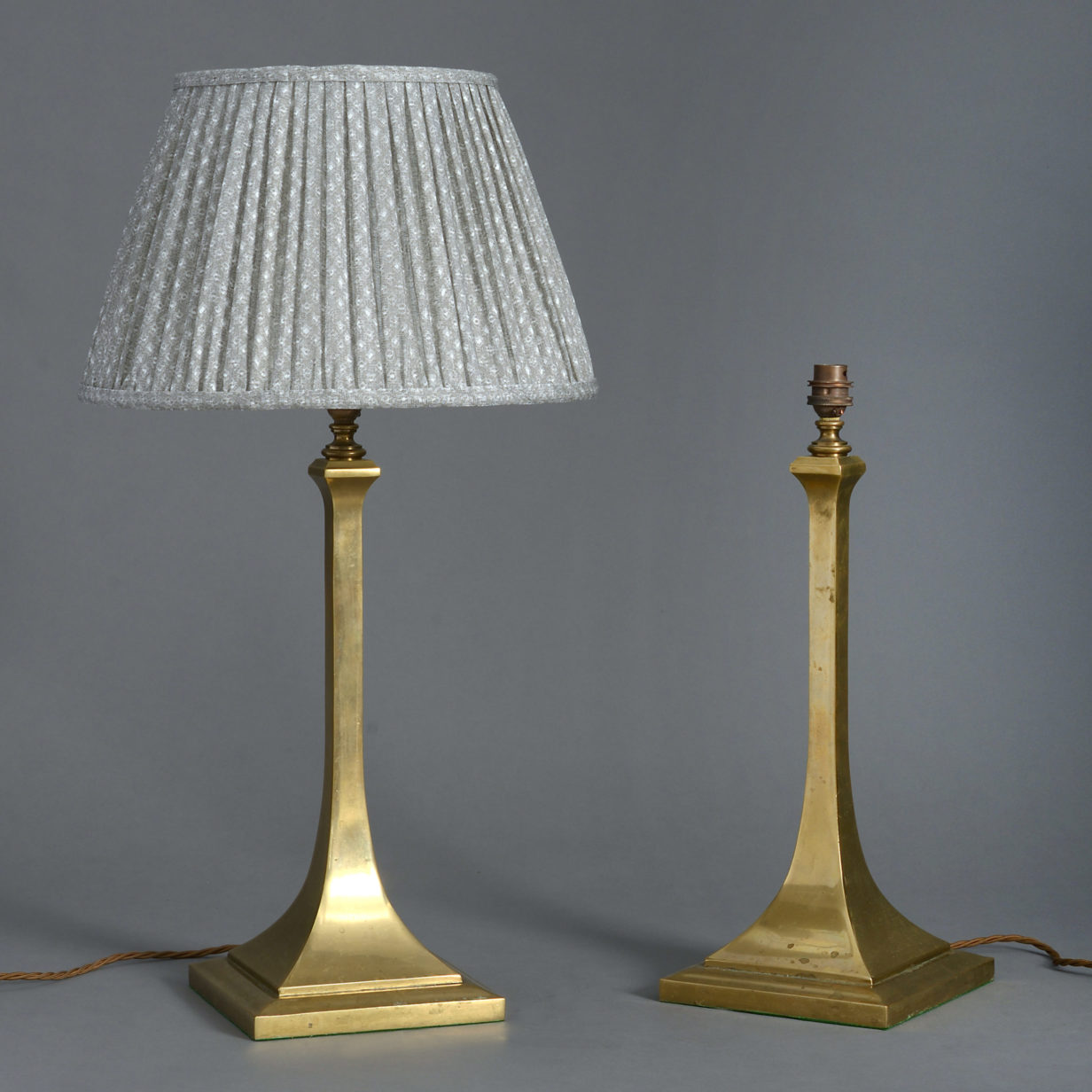 A pair of edwardian brass table lamps