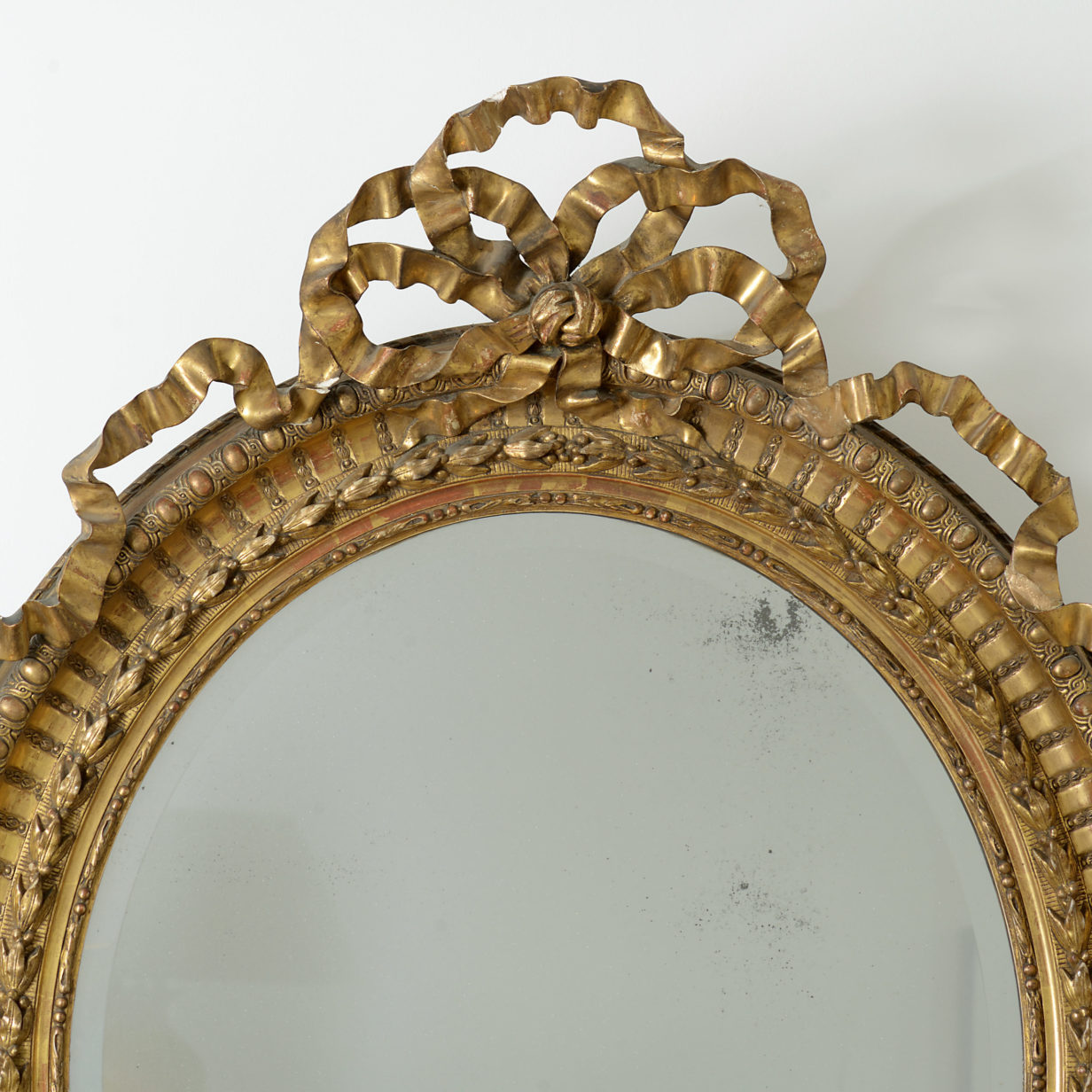 French oval giltwood mirror