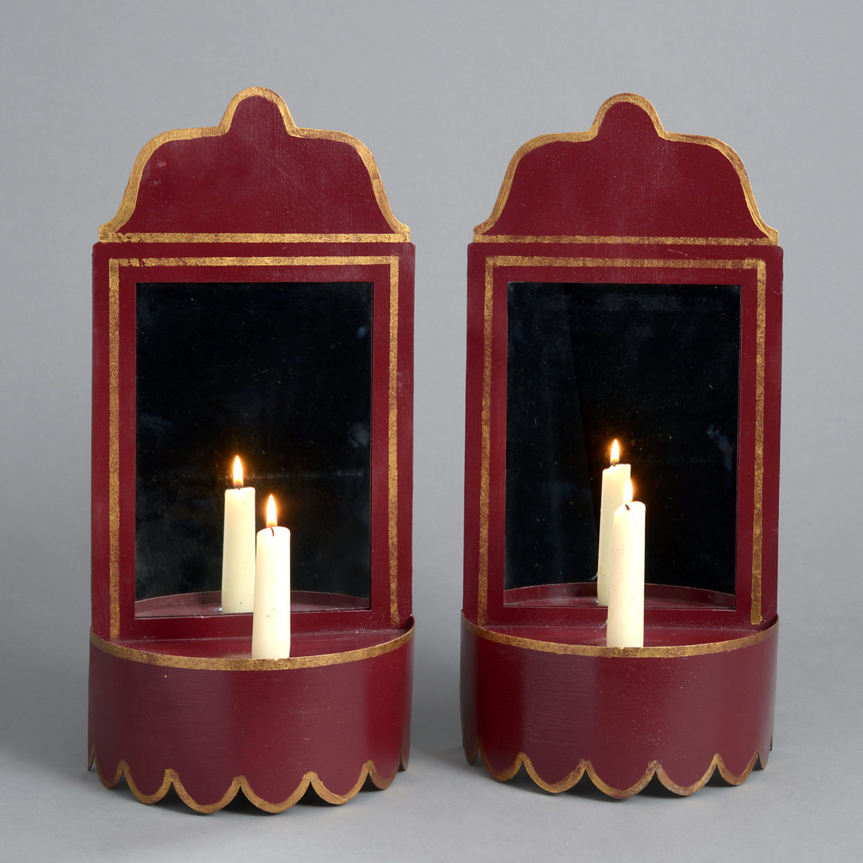Pair of red tole wall lights