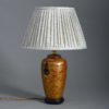 A late 19th century gilt lacquer vase as a table lamp