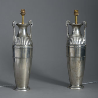 A pair of silvered table lamps