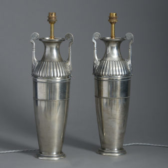 A pair of silvered table lamps