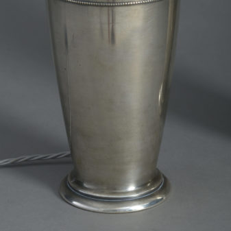 A pair of silvered table lamps