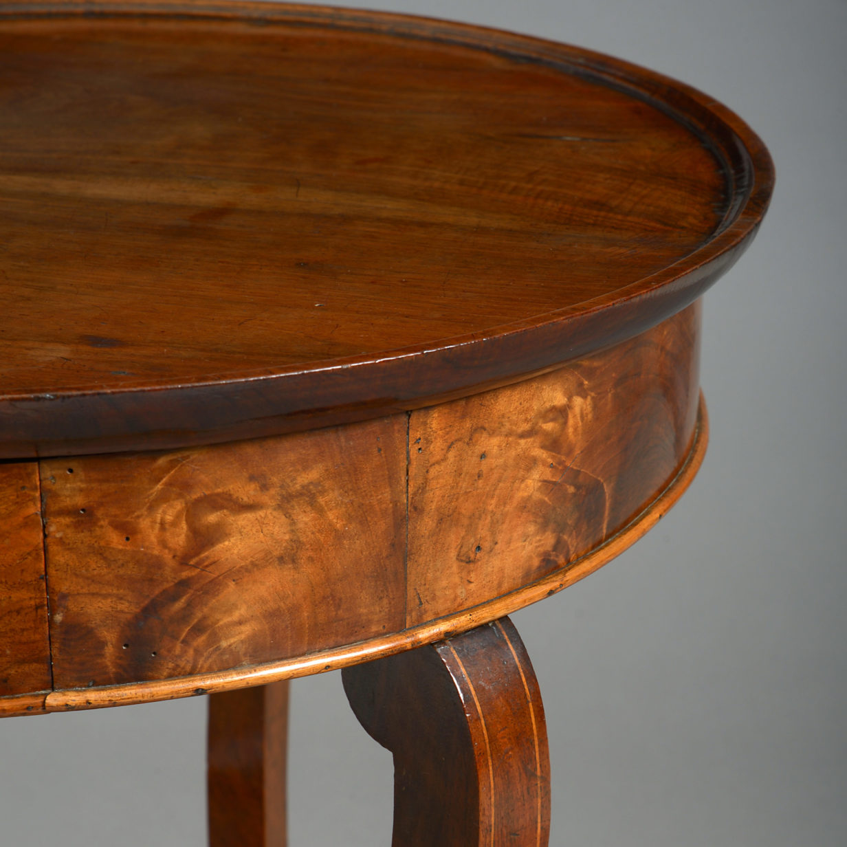 An early 19th century louis philippe period walnut gueridon