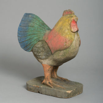 A carved painted model chicken