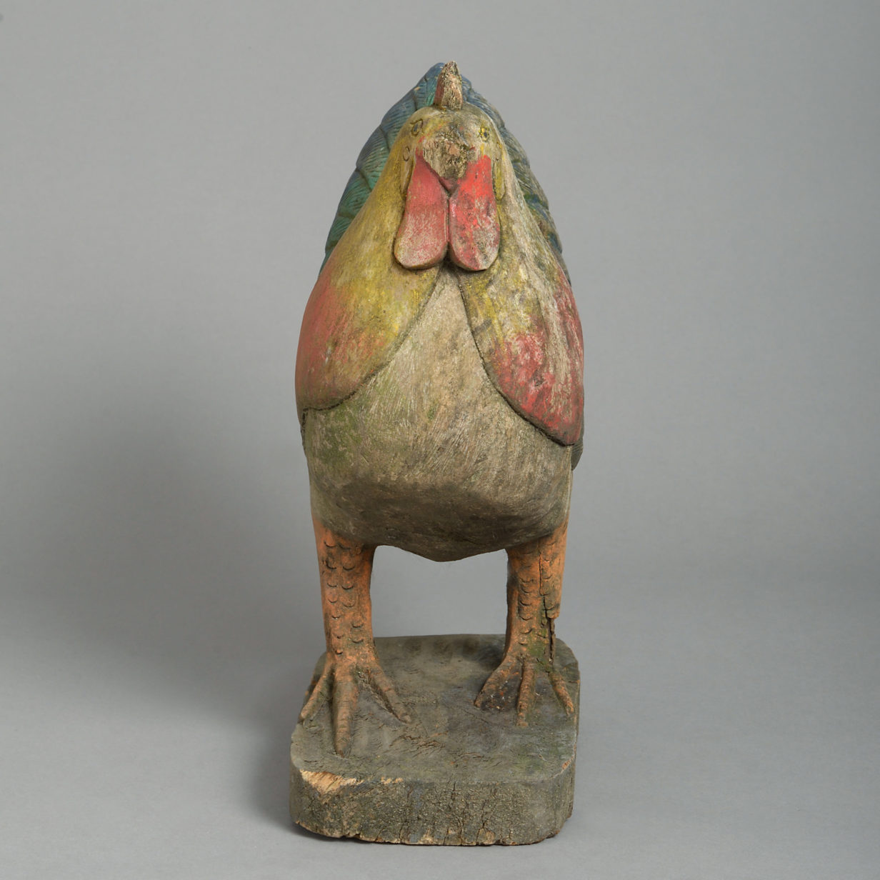 A carved painted model chicken