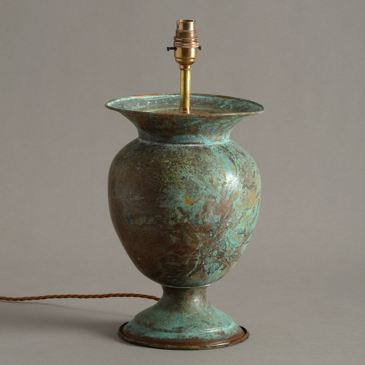 A copper vase lamp base