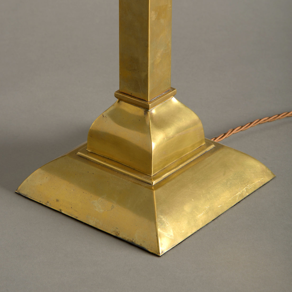 A square brass table lamp