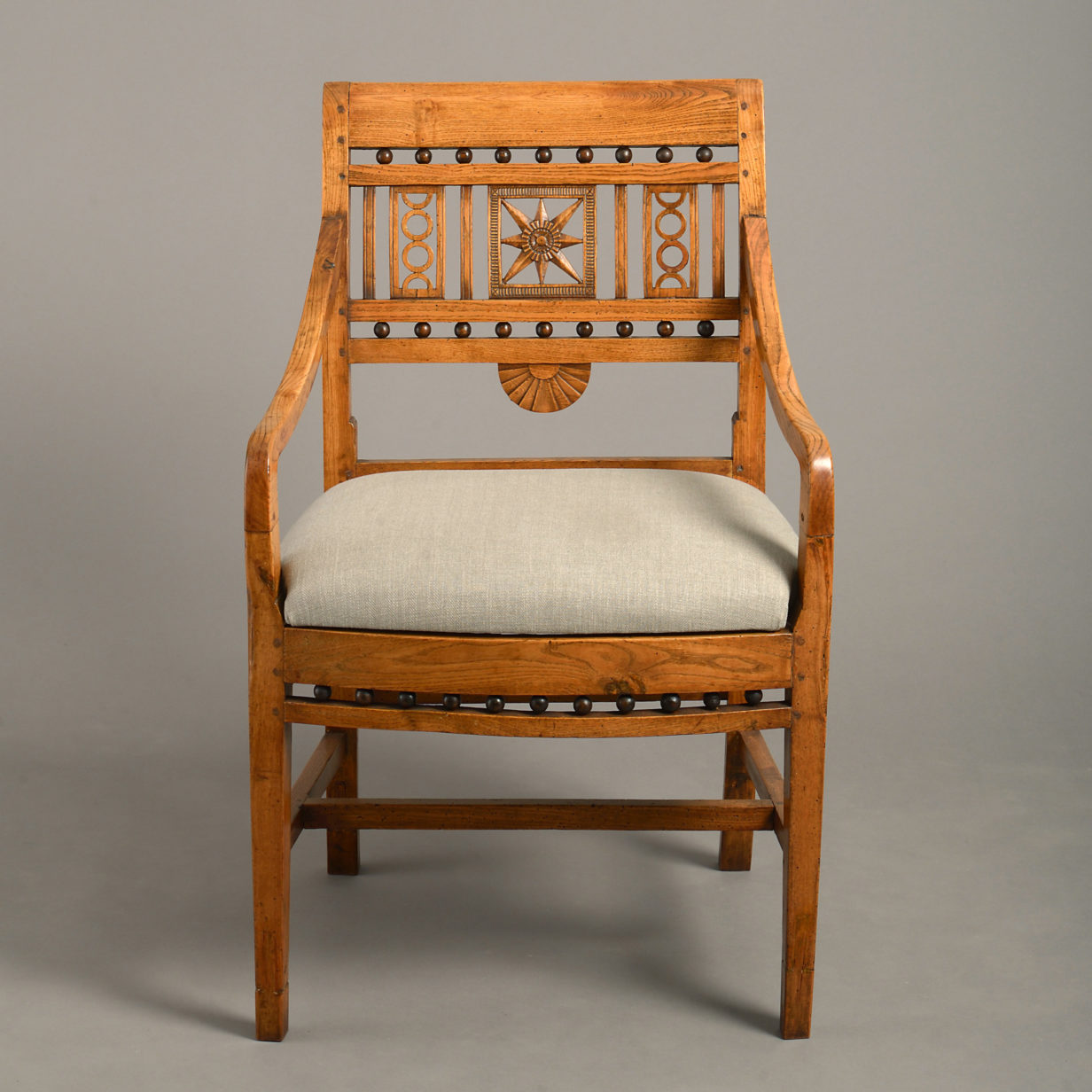 A late 18th century directoire period elm open armchair