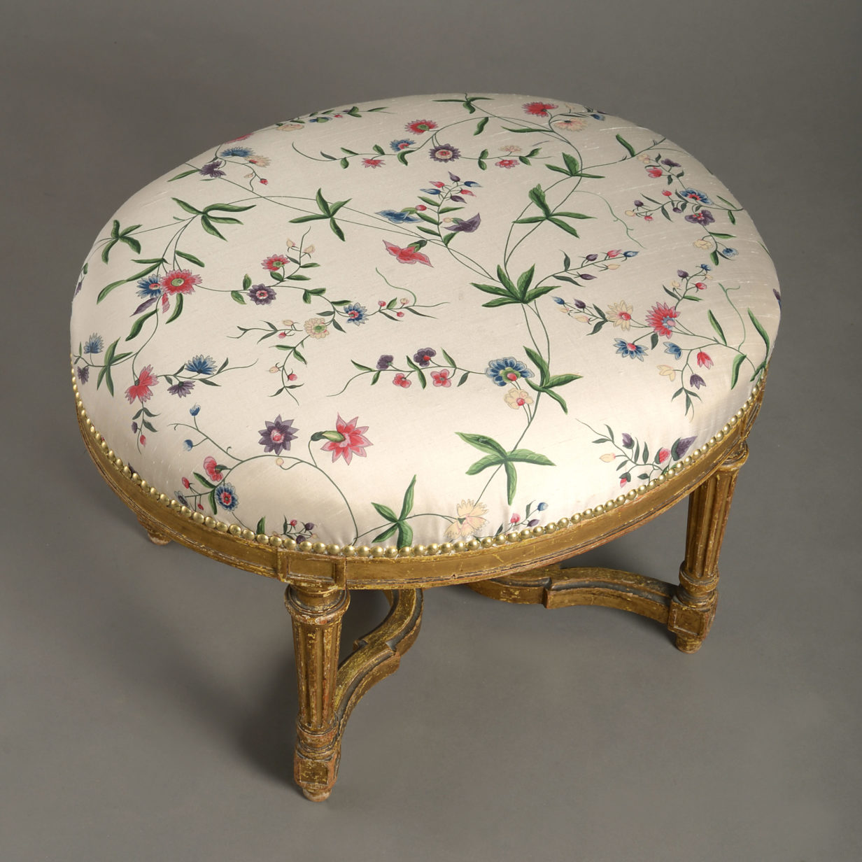 A late 18th century louis xvi period giltwood oval stool