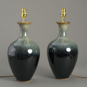 A pair of green porcelain flambé vase lamps