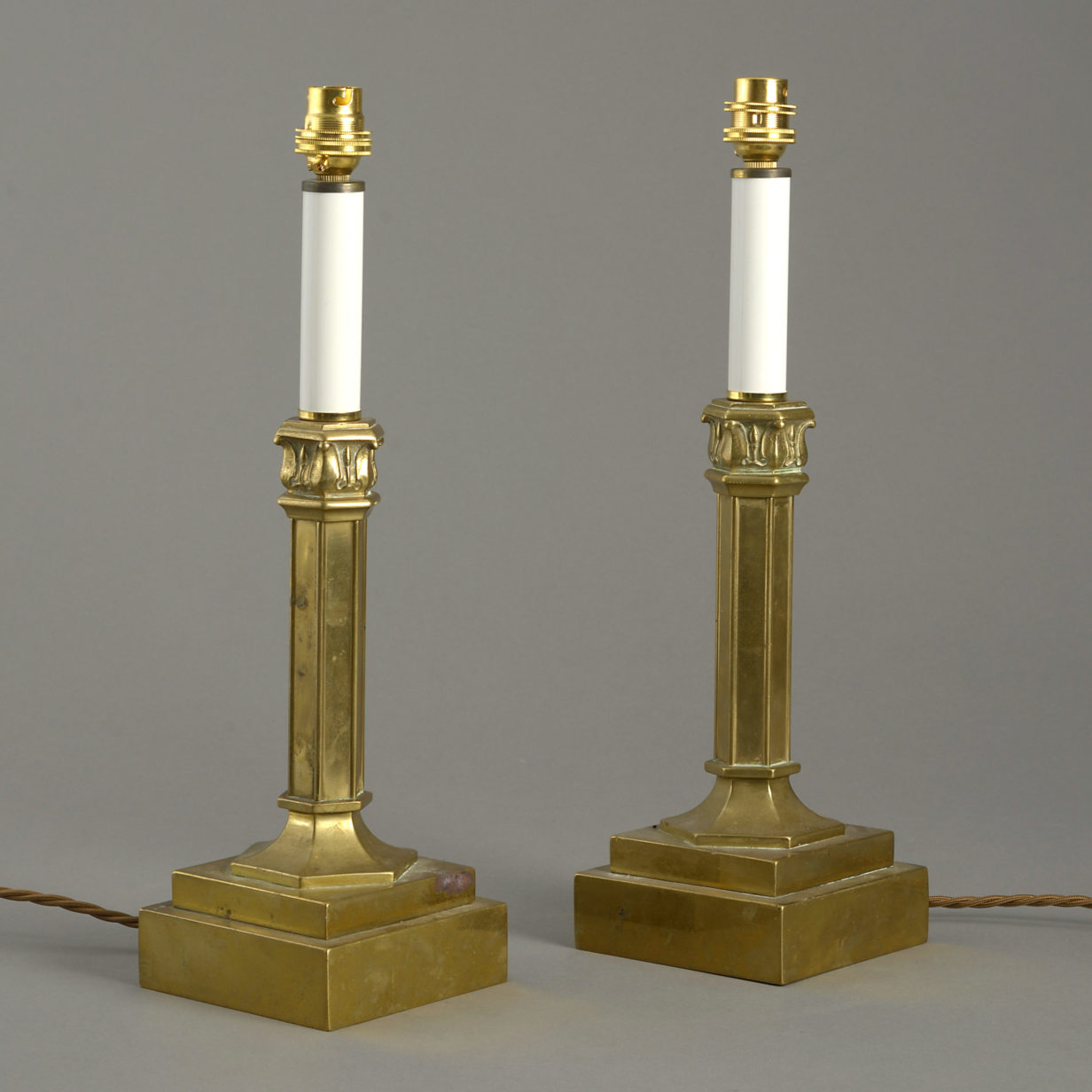 A mid-19th century pair of gilt brass table lamps